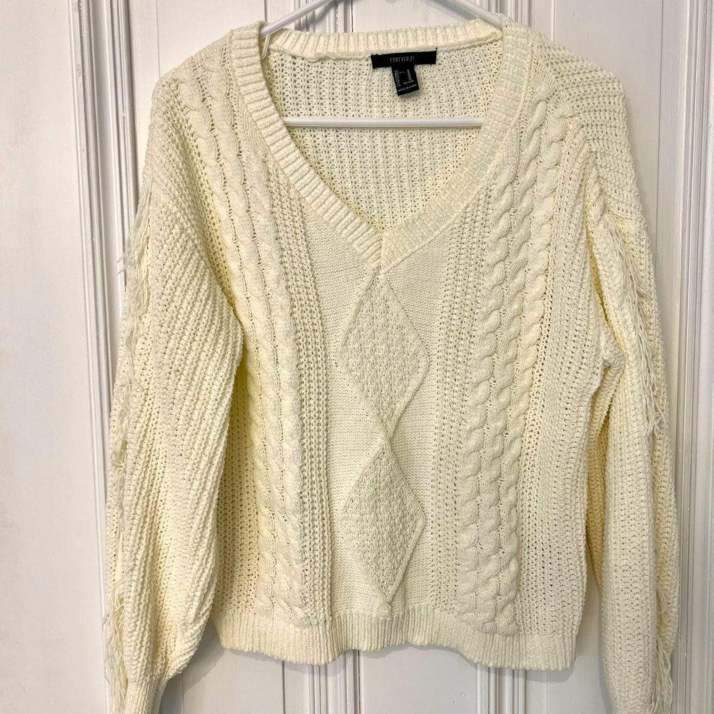 Cream knit sweater with fringe details